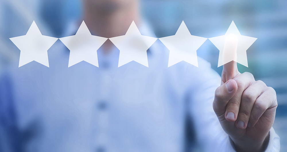 5 stars with a hand pointing to the fifth star